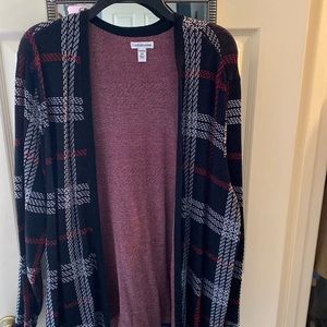 Brand new without tags.   Black/red/white seater